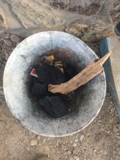 Coal and a stick of wood.